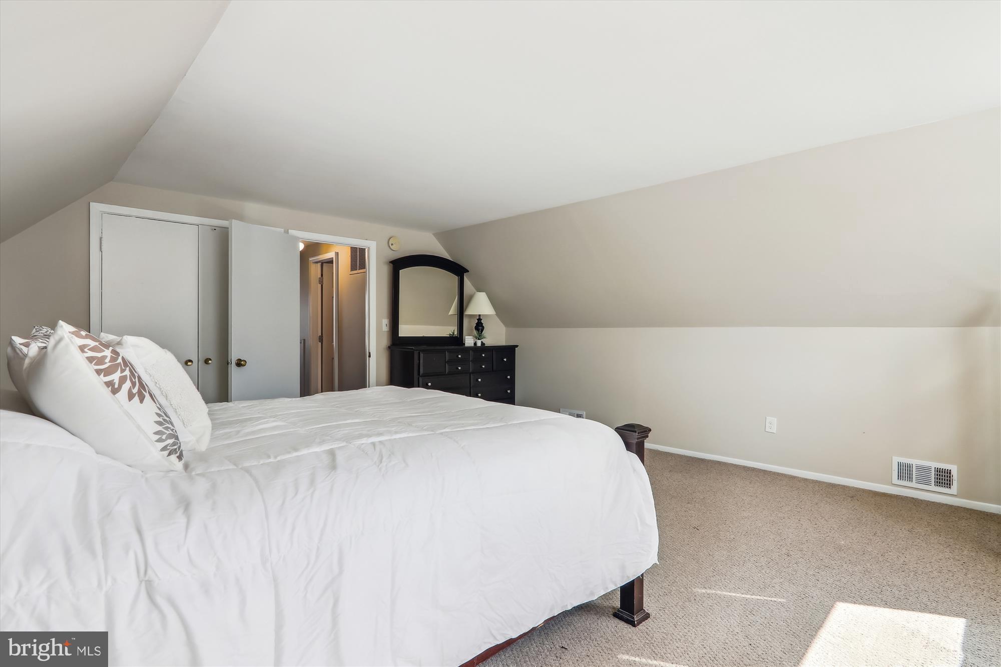 12403 Shawmont Lane Bowie, MD 20715 - Photo 33 of 59 a bedroom with a bed and mirror