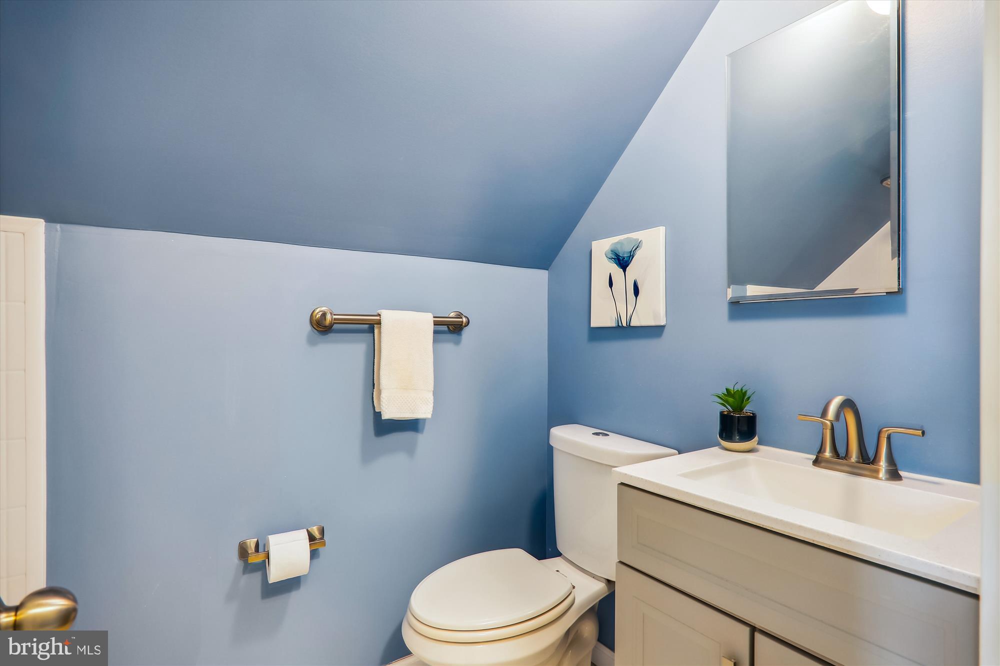 12403 Shawmont Lane Bowie, MD 20715 - Photo 34 of 59 a bathroom with a sink a toilet and mirror