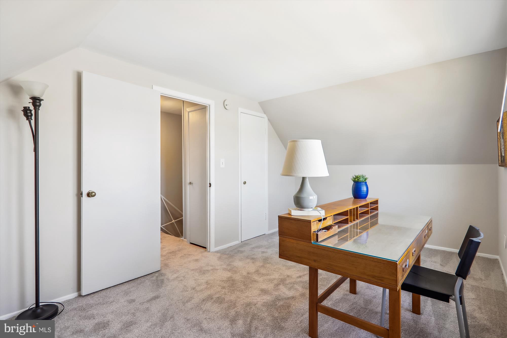 12403 Shawmont Lane Bowie, MD 20715 - Photo 38 of 59 a workspace with furniture and a lamp