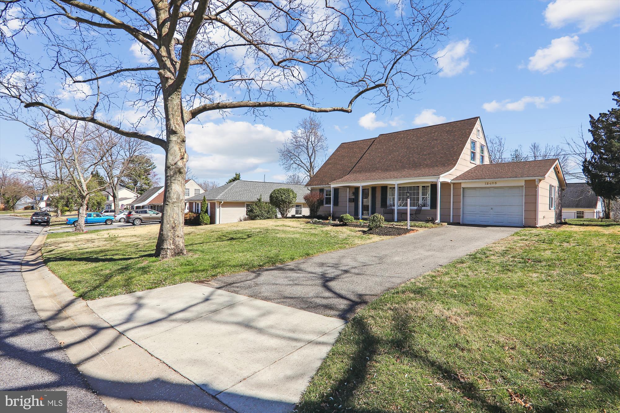 12403 Shawmont Lane Bowie, MD 20715 - Photo 40 of 59 a house that has a tree in it