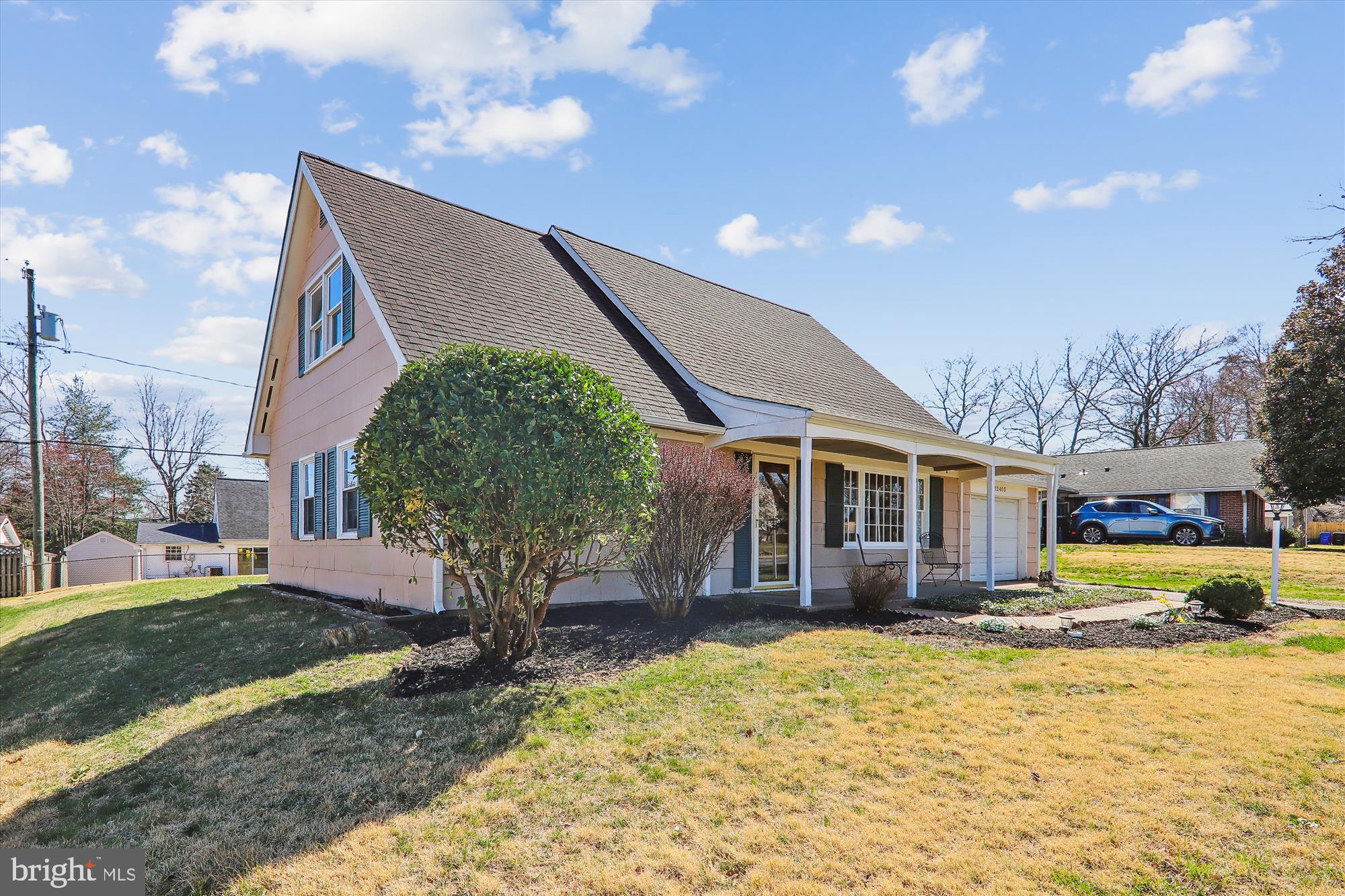 12403 Shawmont Lane Bowie, MD 20715 - Photo 42 of 59 a front view of a house with a yard