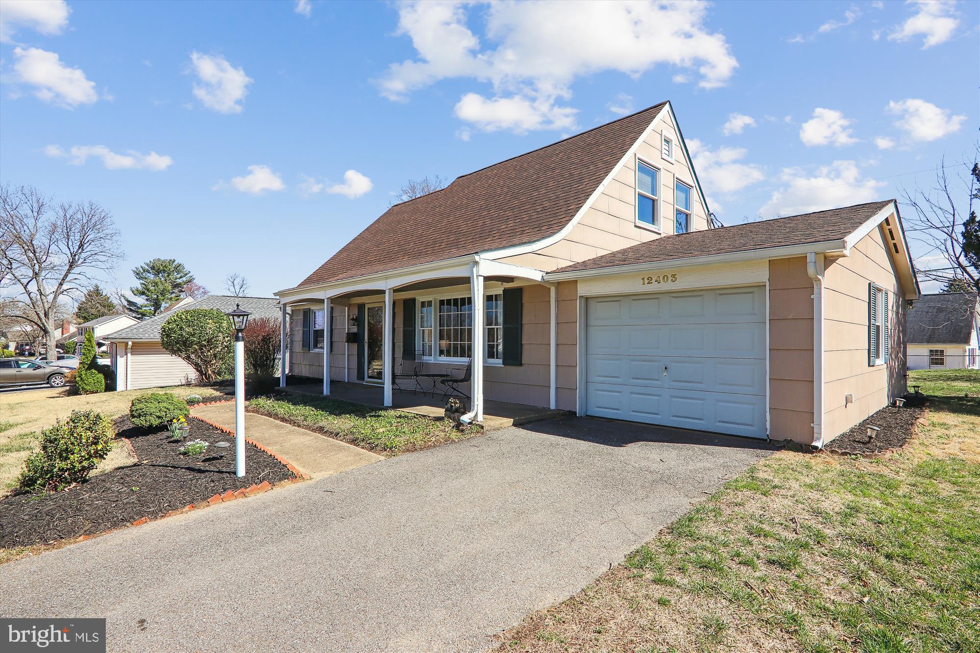 12403 Shawmont Lane Bowie, MD 20715 - Photo 43 of 59 a view of a house with porch and garden