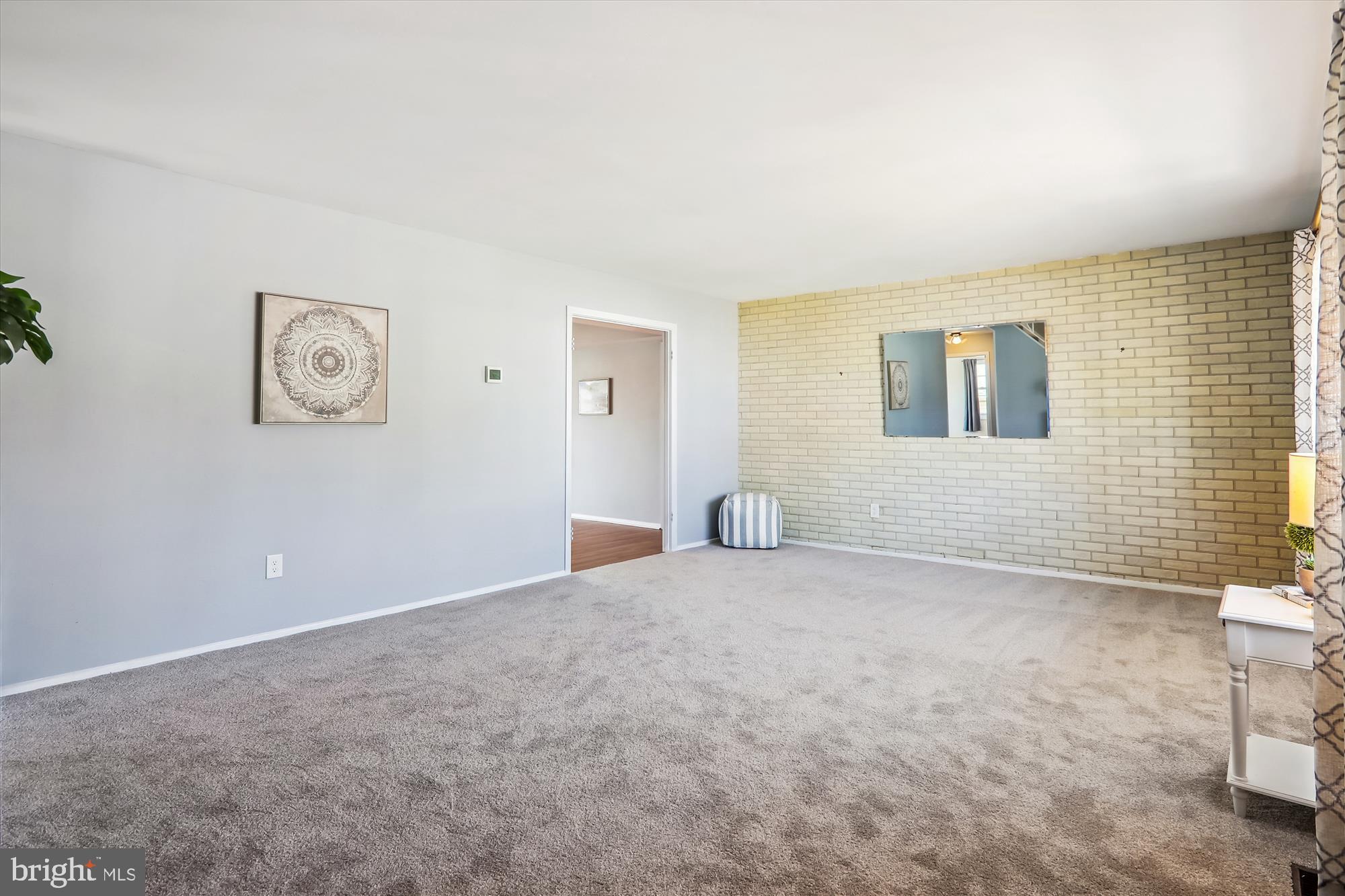 12403 Shawmont Lane Bowie, MD 20715 - Photo 6 of 59 a view of an empty room with a window