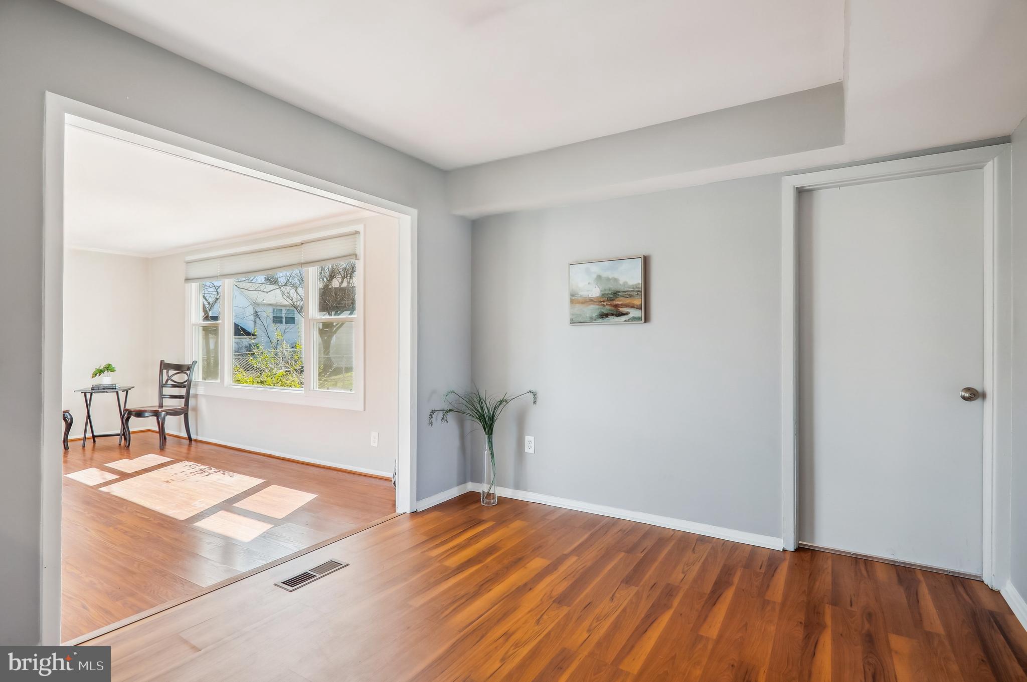 12403 Shawmont Lane Bowie, MD 20715 - Photo 7 of 59 a view of empty room with window and wooden floor