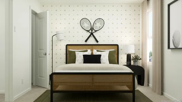 a bedroom with a bed a clock on wall and a window