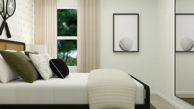 a bedroom with a bed and window