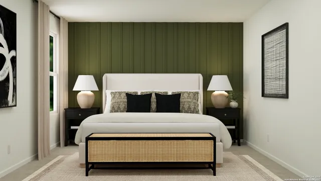 a bedroom with a bed lamp and wooden floor