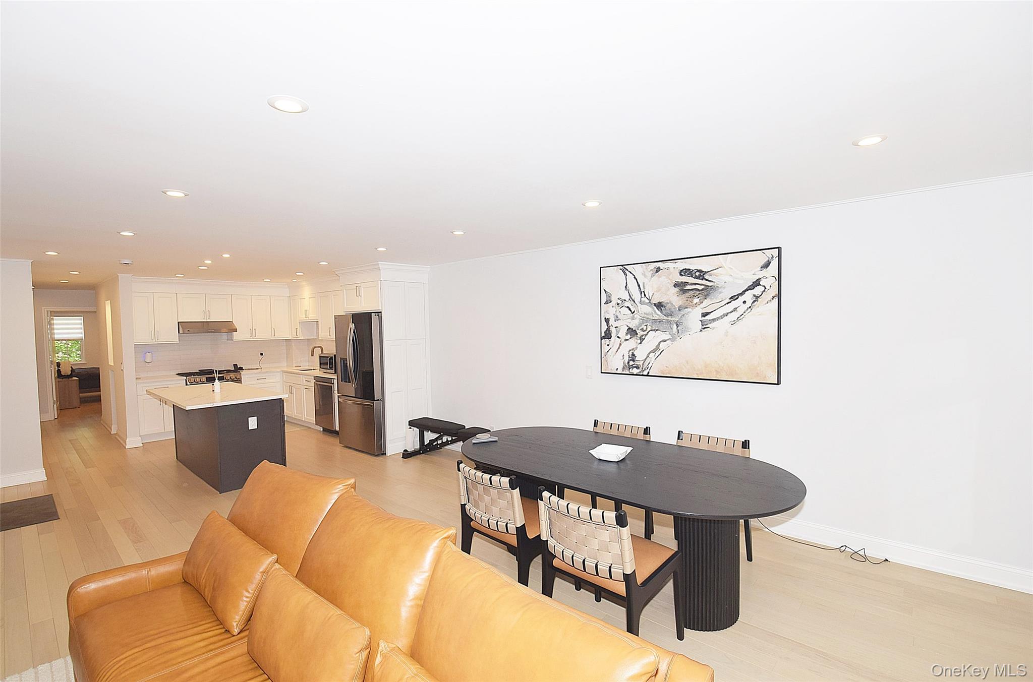 208-08 Robert Road, Unit 191M Queens, NY 11360 - Photo 18 of 37 a view of a dining room with furniture