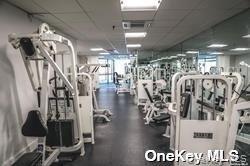 208-08 Robert Road, Unit 191M Queens, NY 11360 - Photo 30 of 37 a view of a room with gym equipment