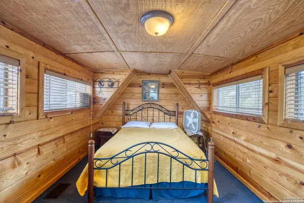 a view of entryway with a window and wooden floor