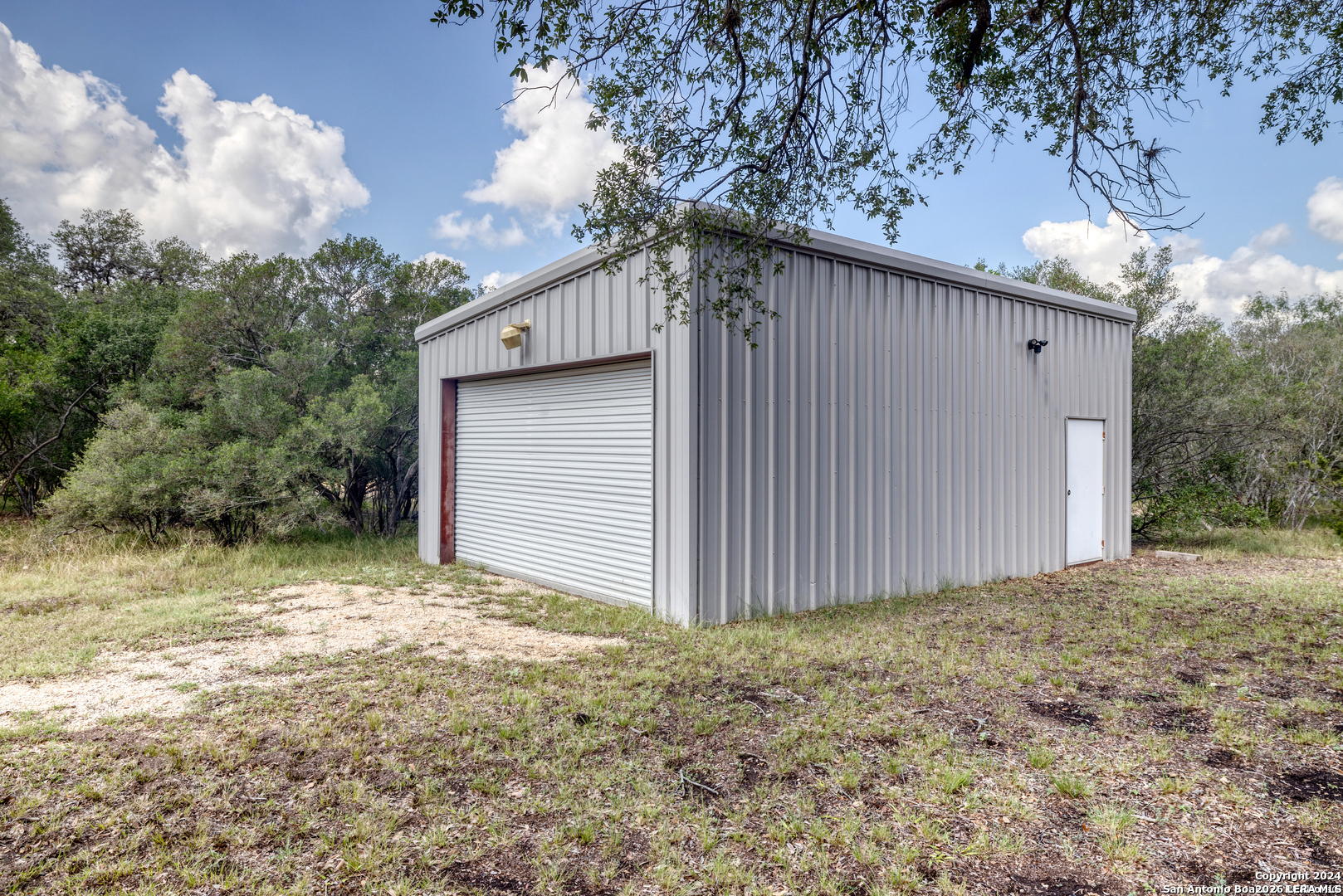 711 Mariposa Concan, TX 78838 - Photo 19 of 23 a backyard of a house