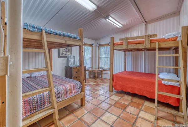 a bedroom with bed and a window