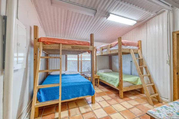 a bedroom with a bed and a table