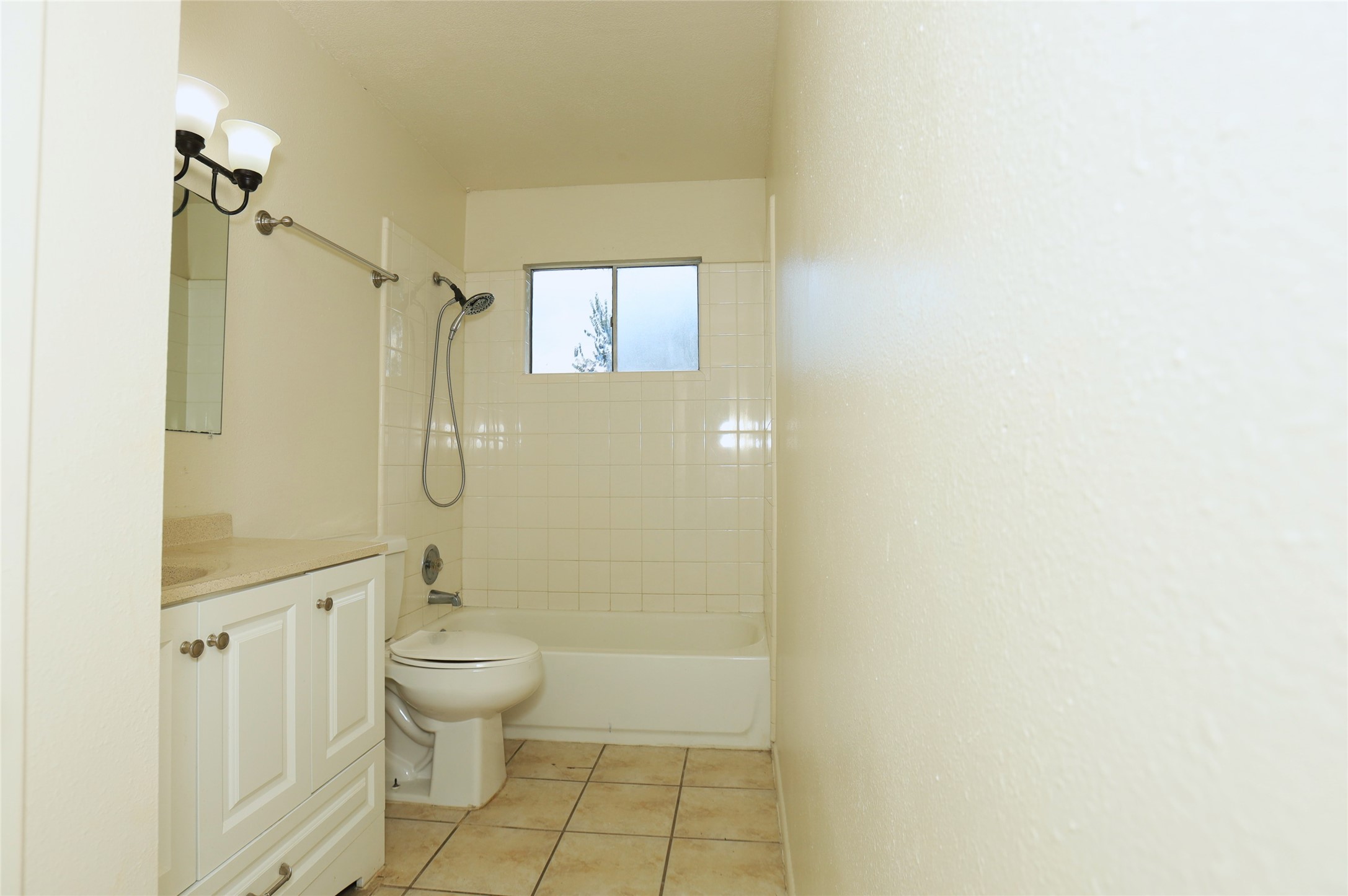 1131 Gifford Road Angleton, TX 77515 - Photo 13 of 14 a bathroom with a granite countertop sink a toilet and shower