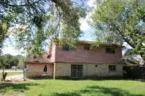 a view of a house with a garden