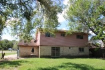 1131 Gifford Road Angleton, TX 77515 - Photo 14 of 14 a view of a house with a garden