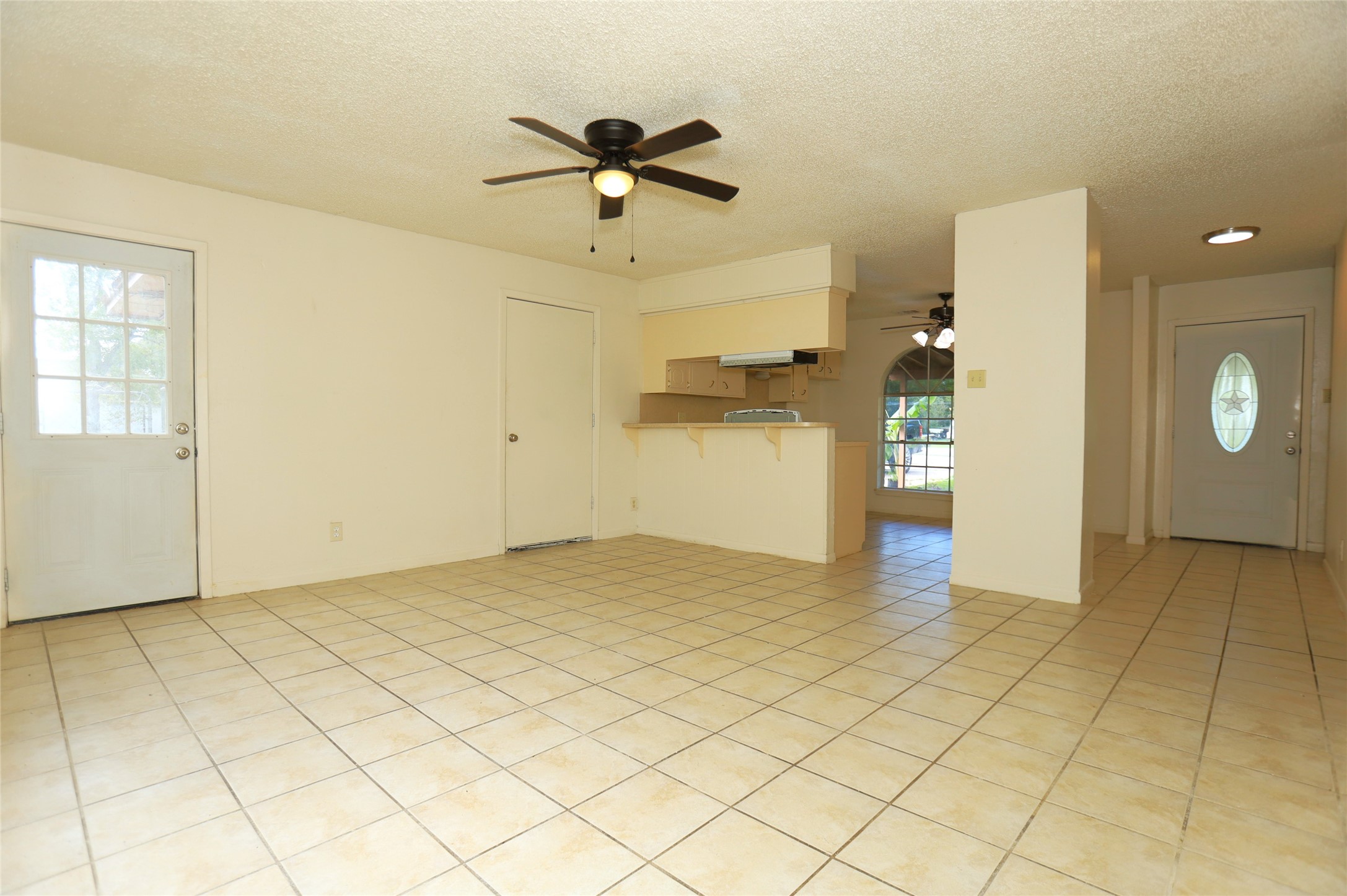 1131 Gifford Road Angleton, TX 77515 - Photo 3 of 14 a view of a livingroom with a chandelier fan and wooden floor