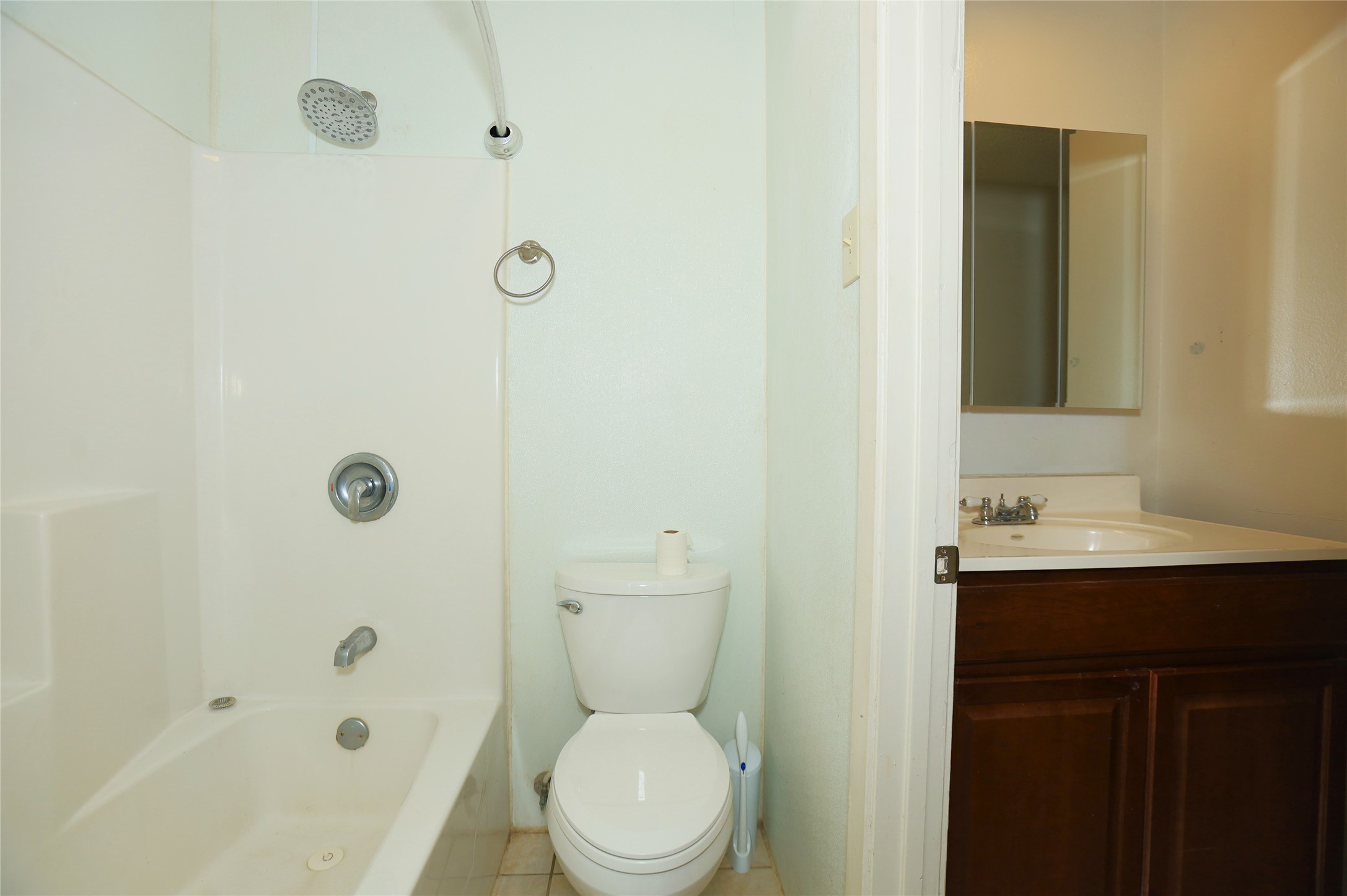 1131 Gifford Road Angleton, TX 77515 - Photo 8 of 14 a bathroom with a toilet a sink a mirror and shower