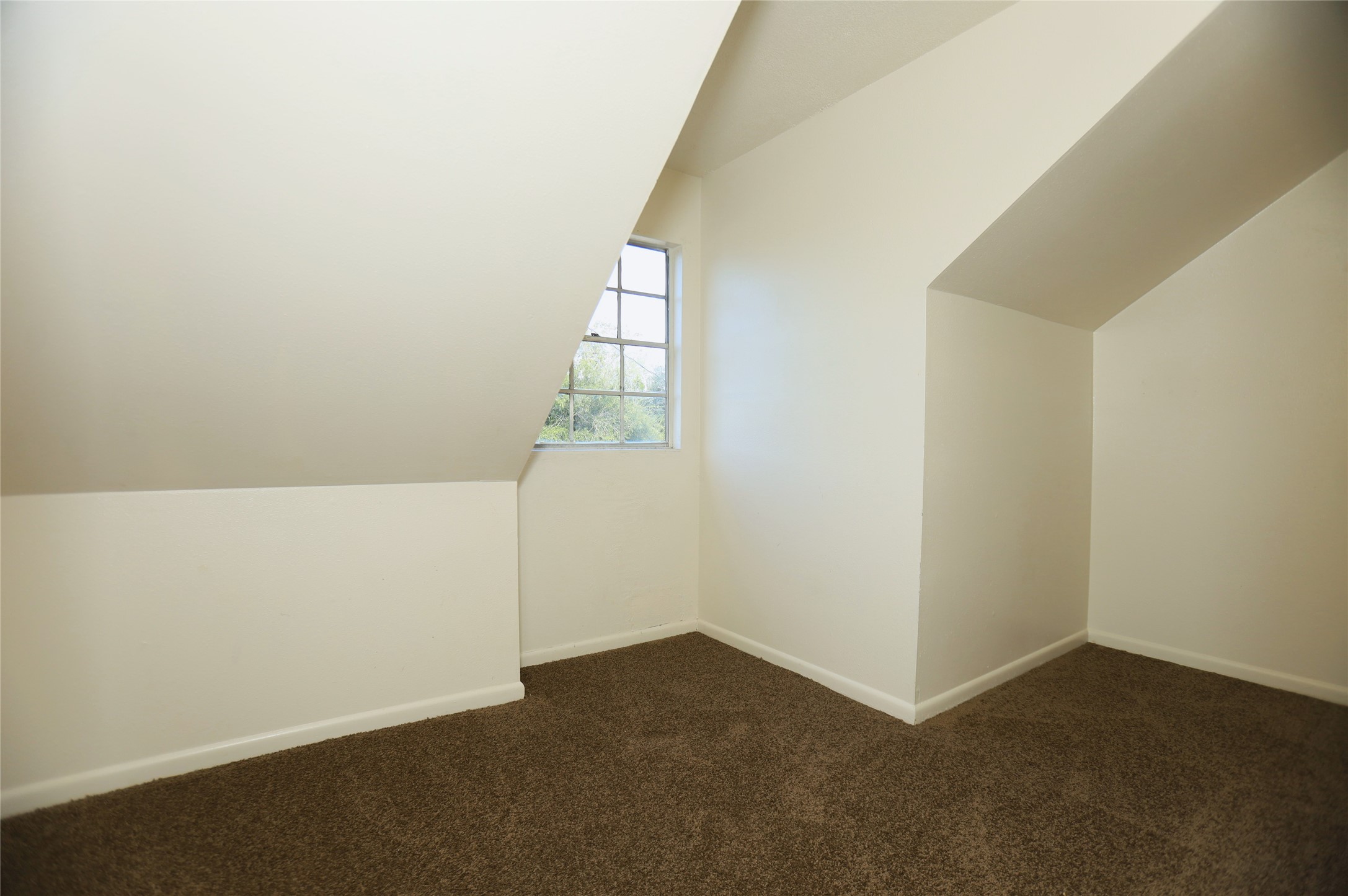 1131 Gifford Road Angleton, TX 77515 - Photo 10 of 14 an empty room with windows
