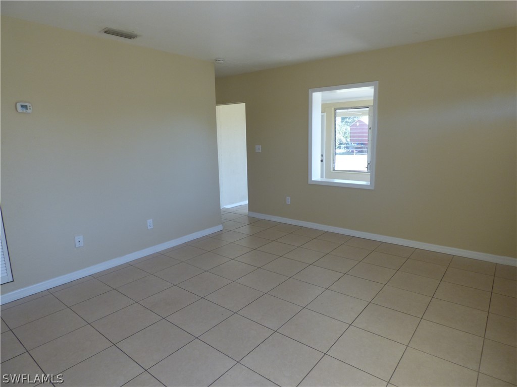 307 East Penn Road Lehigh Acres, FL 33936 - Photo 11 of 20 an empty room with windows
