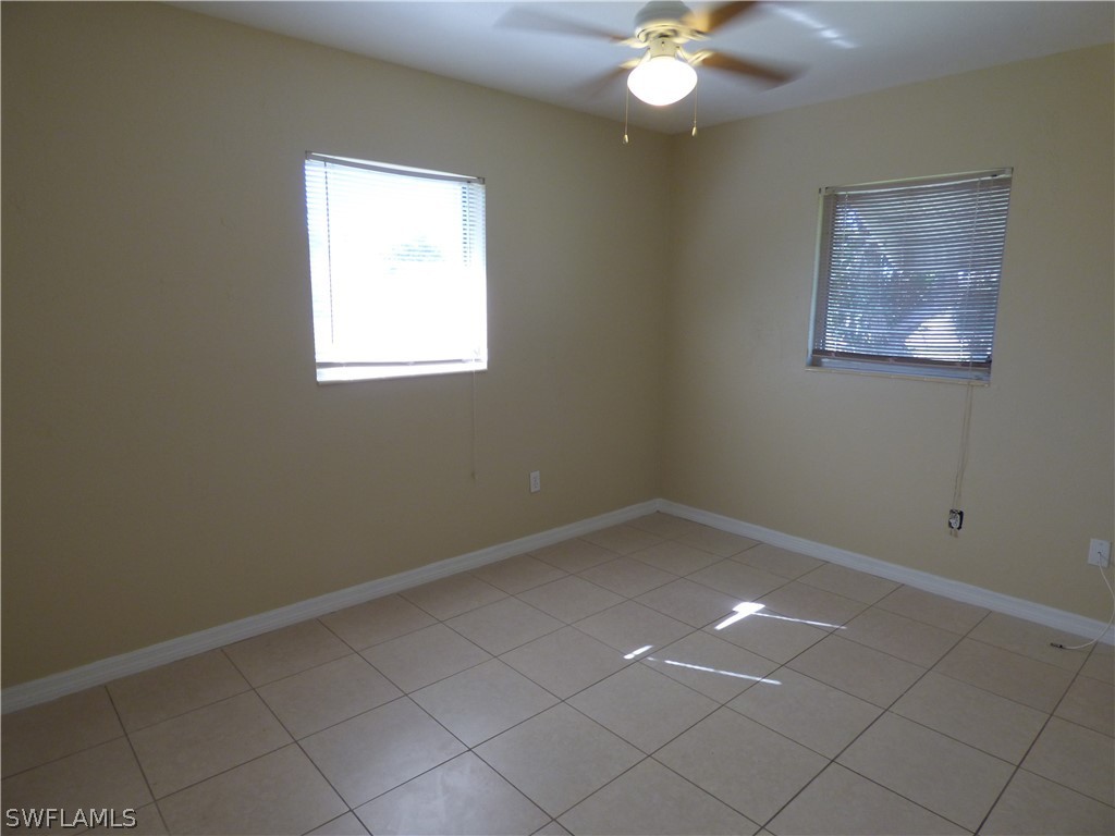 307 East Penn Road Lehigh Acres, FL 33936 - Photo 17 of 20 a view of an empty room with a window