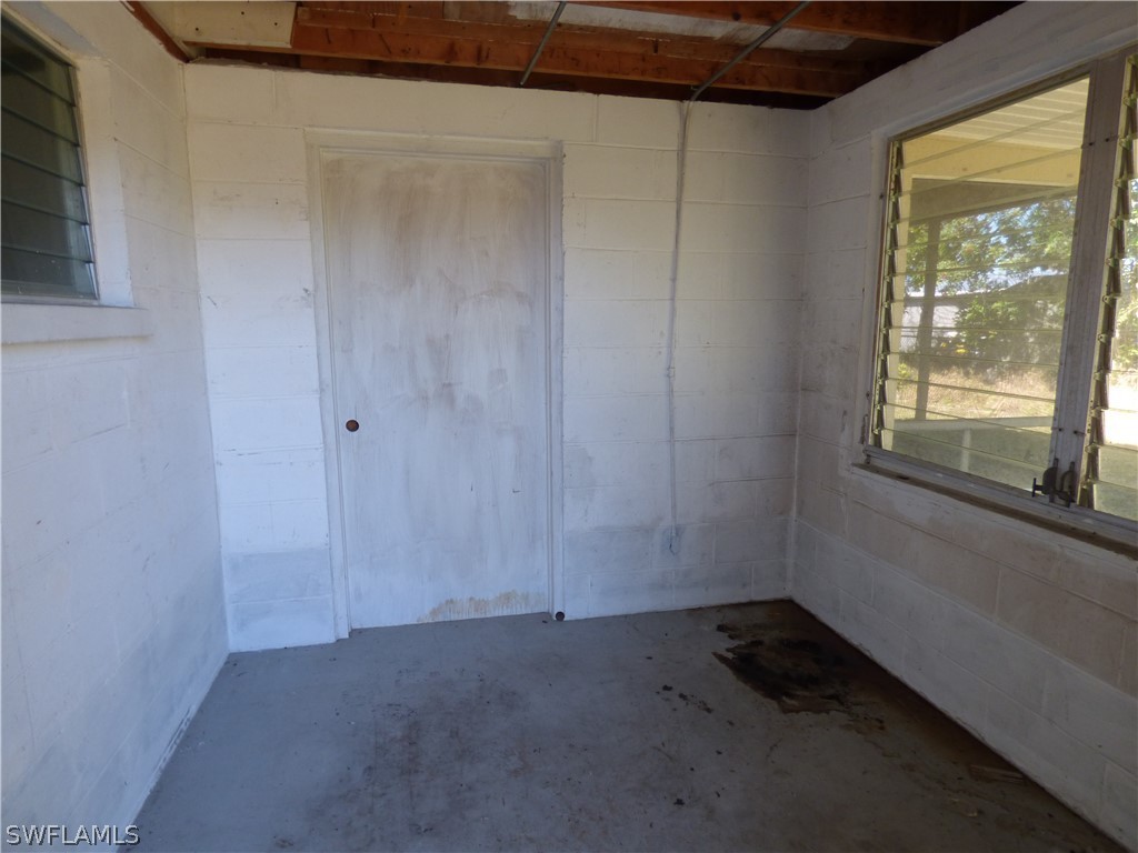 307 East Penn Road Lehigh Acres, FL 33936 - Photo 4 of 20 a room that has a window in it