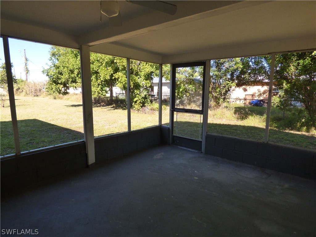 307 East Penn Road Lehigh Acres, FL 33936 - Photo 8 of 20 a view of an empty room with a large window