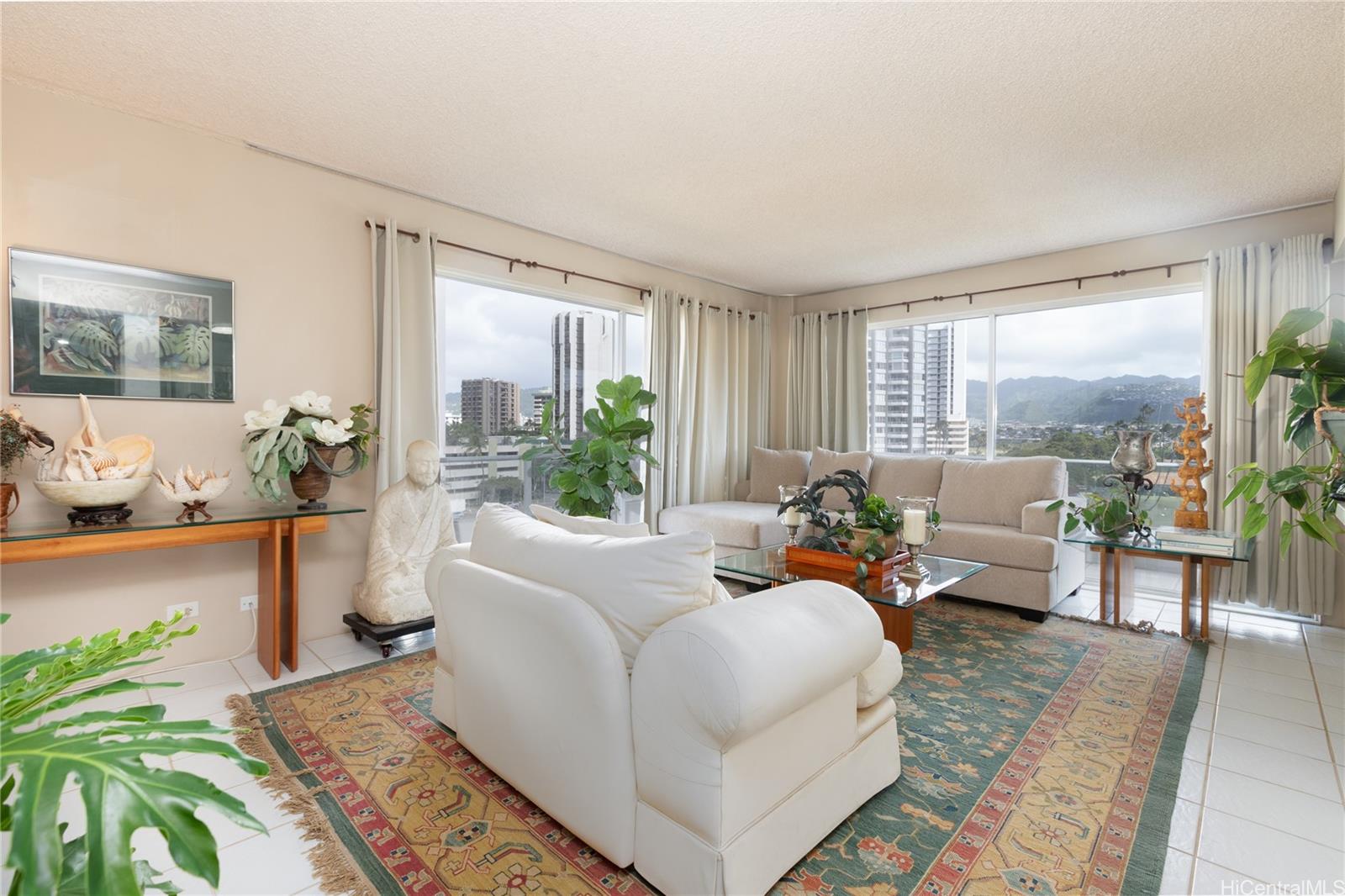 240 Makee Road, Unit 6C Honolulu, HI 96815 - Photo 1 of 1 a living room with furniture and a large window
