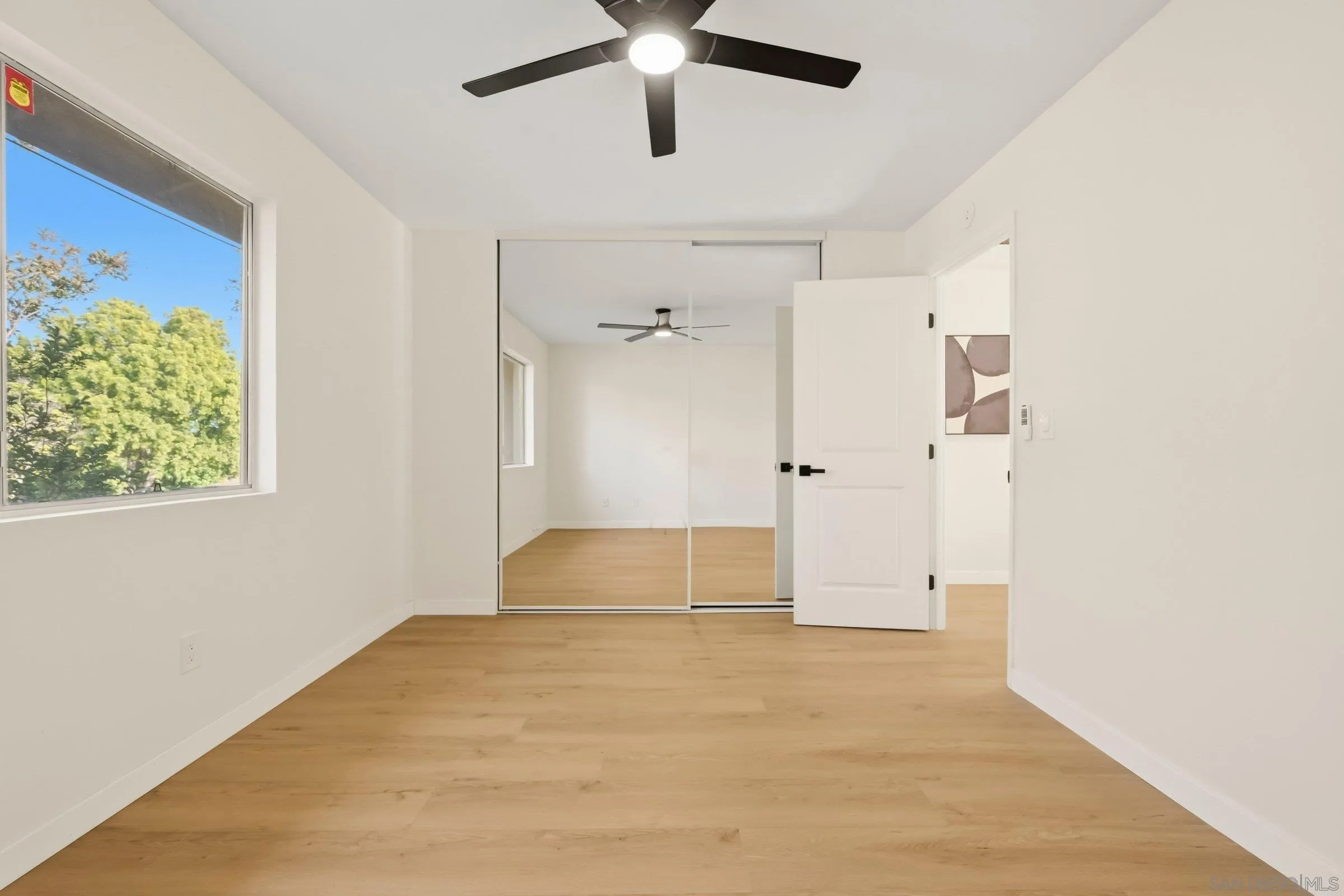 458 Ridgeway Court Spring Valley, CA 91977 - Photo 21 of 26 a view of empty room with wooden floor and ceiling fan