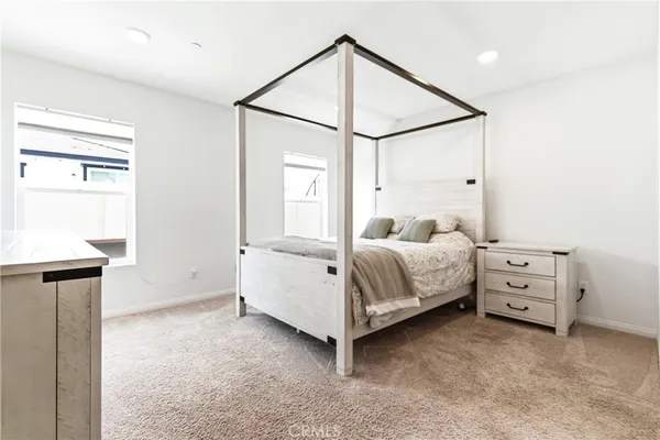 a bed room with a bed and a window