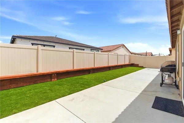 a view of a back yard of the house