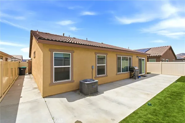 a front view of a house with a patio