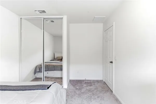 a room with a bed and a view of bathroom