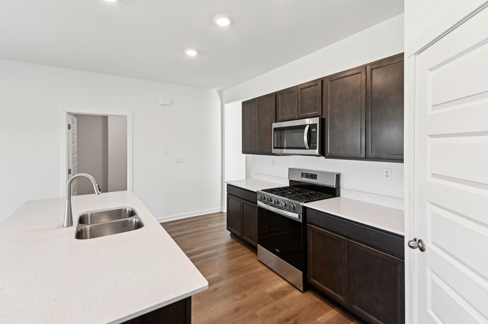 829 Mesa Lane Pingree Grove, IL 60140 - Photo 16 of 55 a kitchen with granite countertop a stove top oven and sink