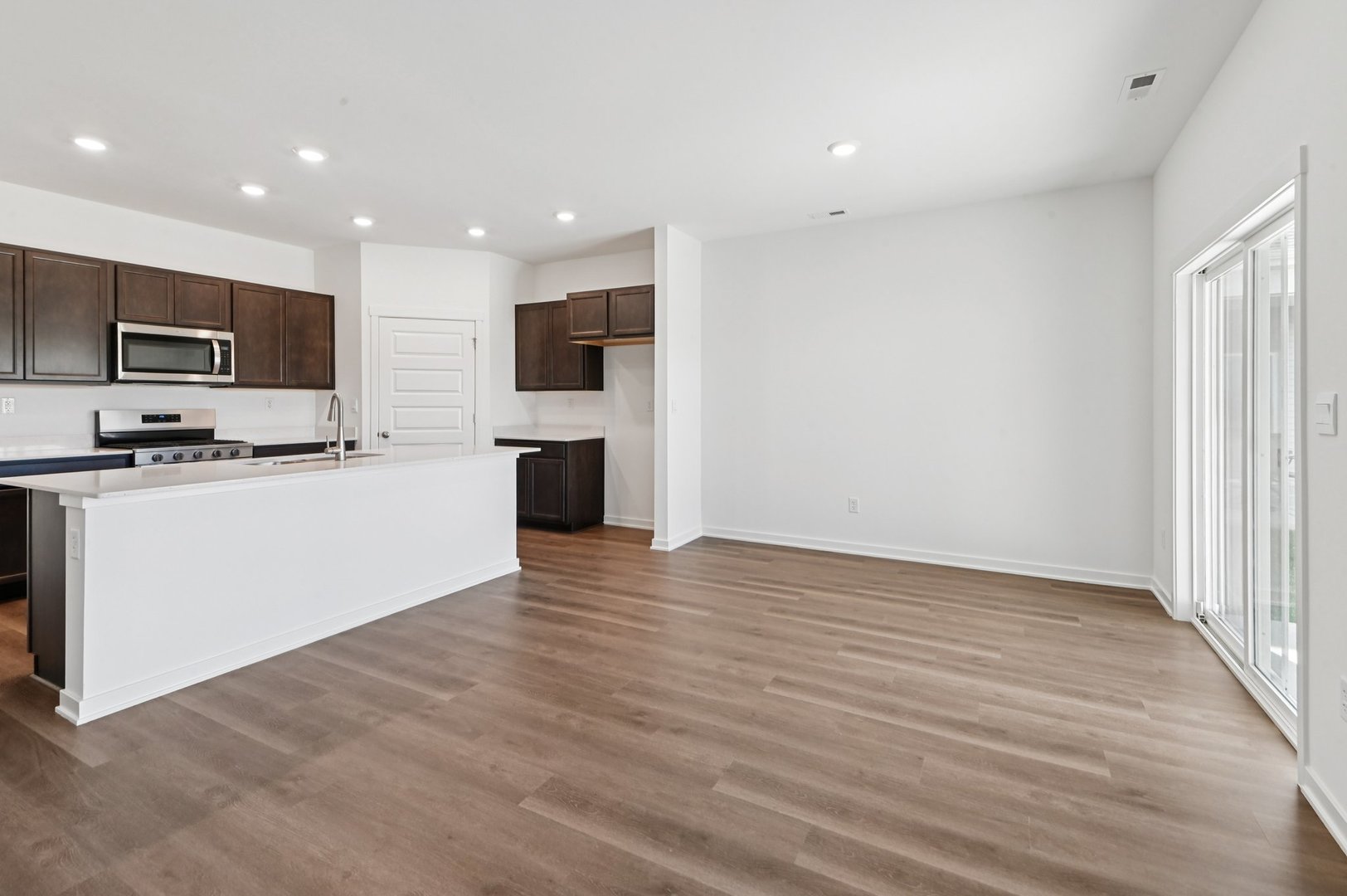 829 Mesa Lane Pingree Grove, IL 60140 - Photo 19 of 55 a view of kitchen with kitchen island stainless steel appliances refrigerator stove microwave and cabinets