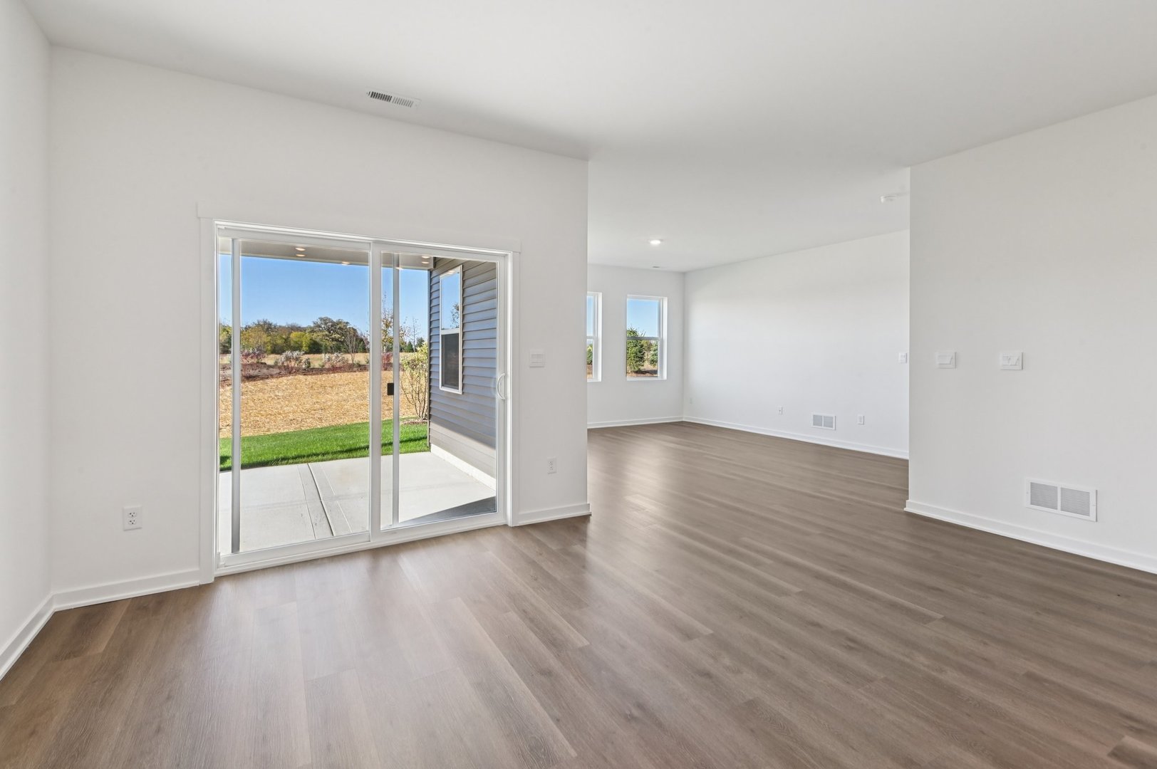 829 Mesa Lane Pingree Grove, IL 60140 - Photo 20 of 55 an empty room with wooden floor and door