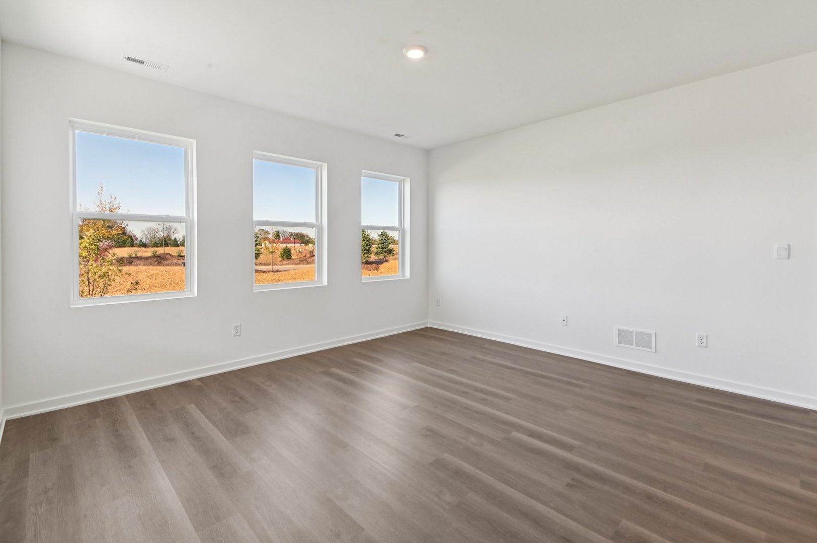 829 Mesa Lane Pingree Grove, IL 60140 - Photo 22 of 55 an empty room with wooden floor and windows
