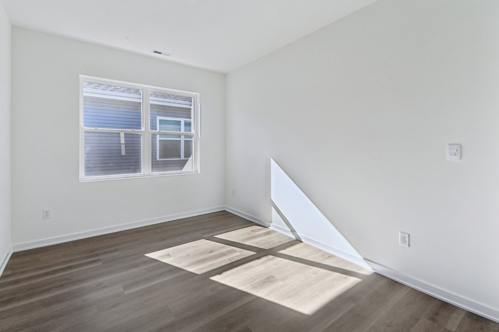 829 Mesa Lane Pingree Grove, IL 60140 - Photo 8 of 55 a view of an empty room with wooden floor and a window