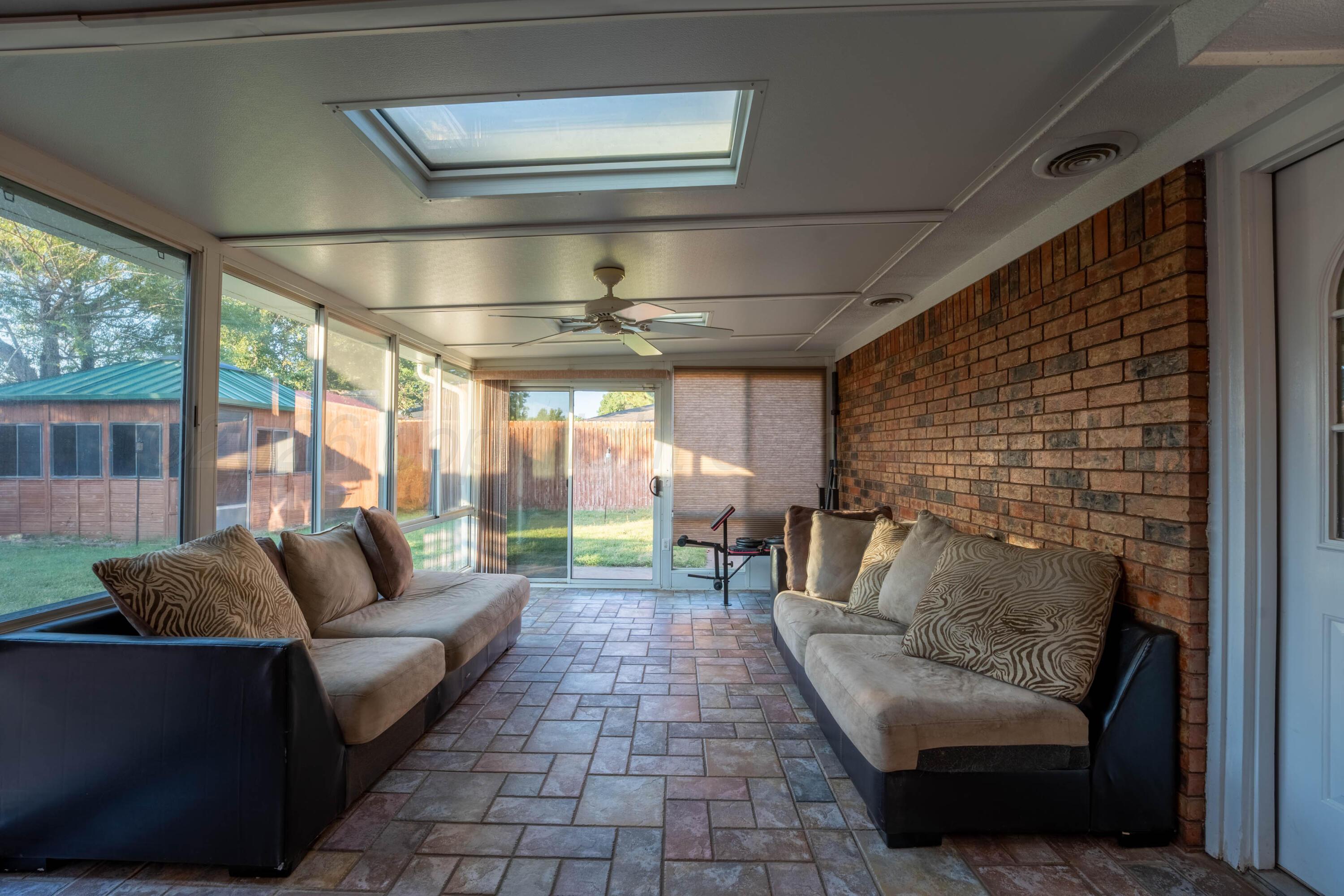 6606 Drexel Road Amarillo, TX 79109 - Photo 11 of 44 a living room with furniture and a fireplace