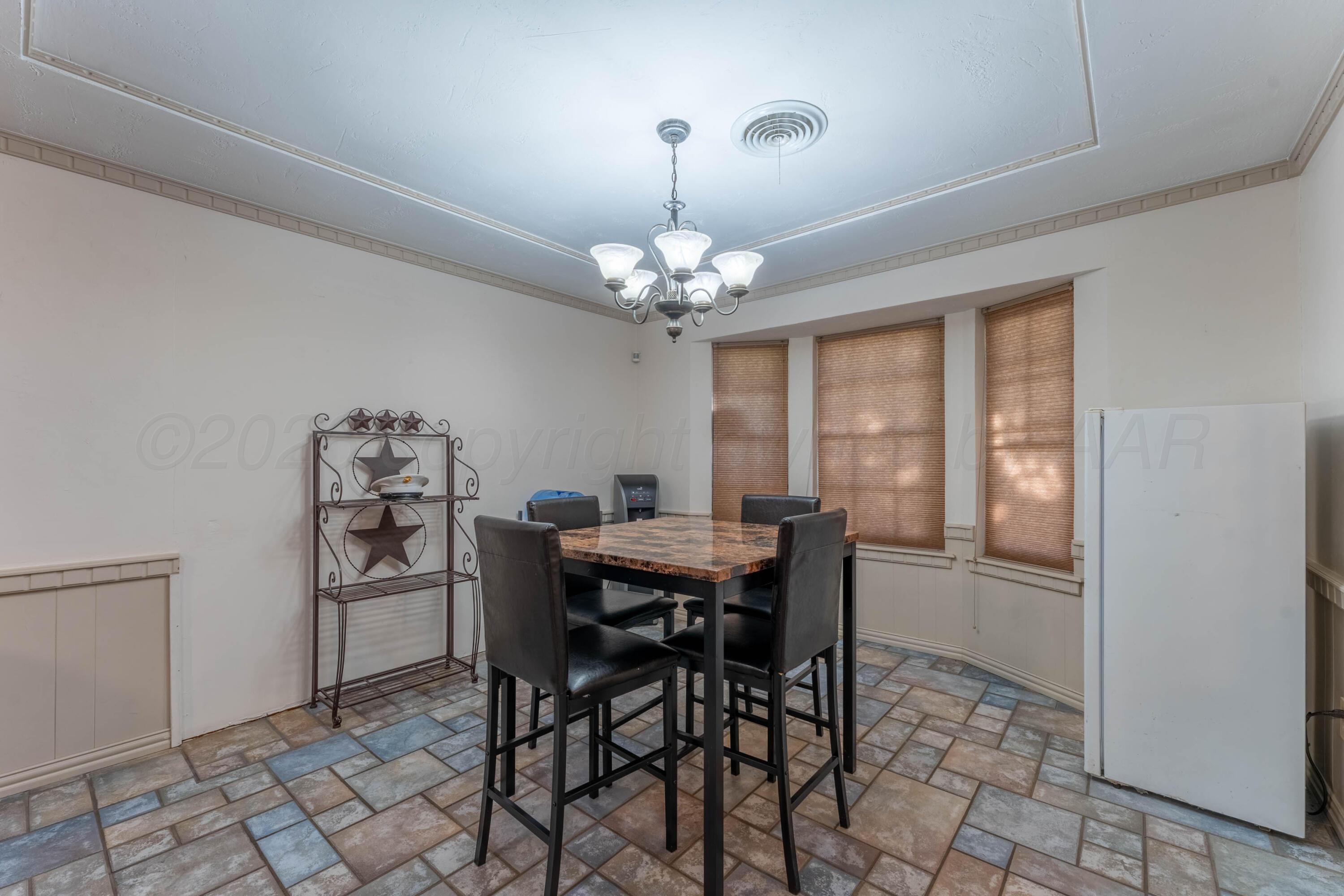 6606 Drexel Road Amarillo, TX 79109 - Photo 20 of 44 a view of a dining room with furniture and window