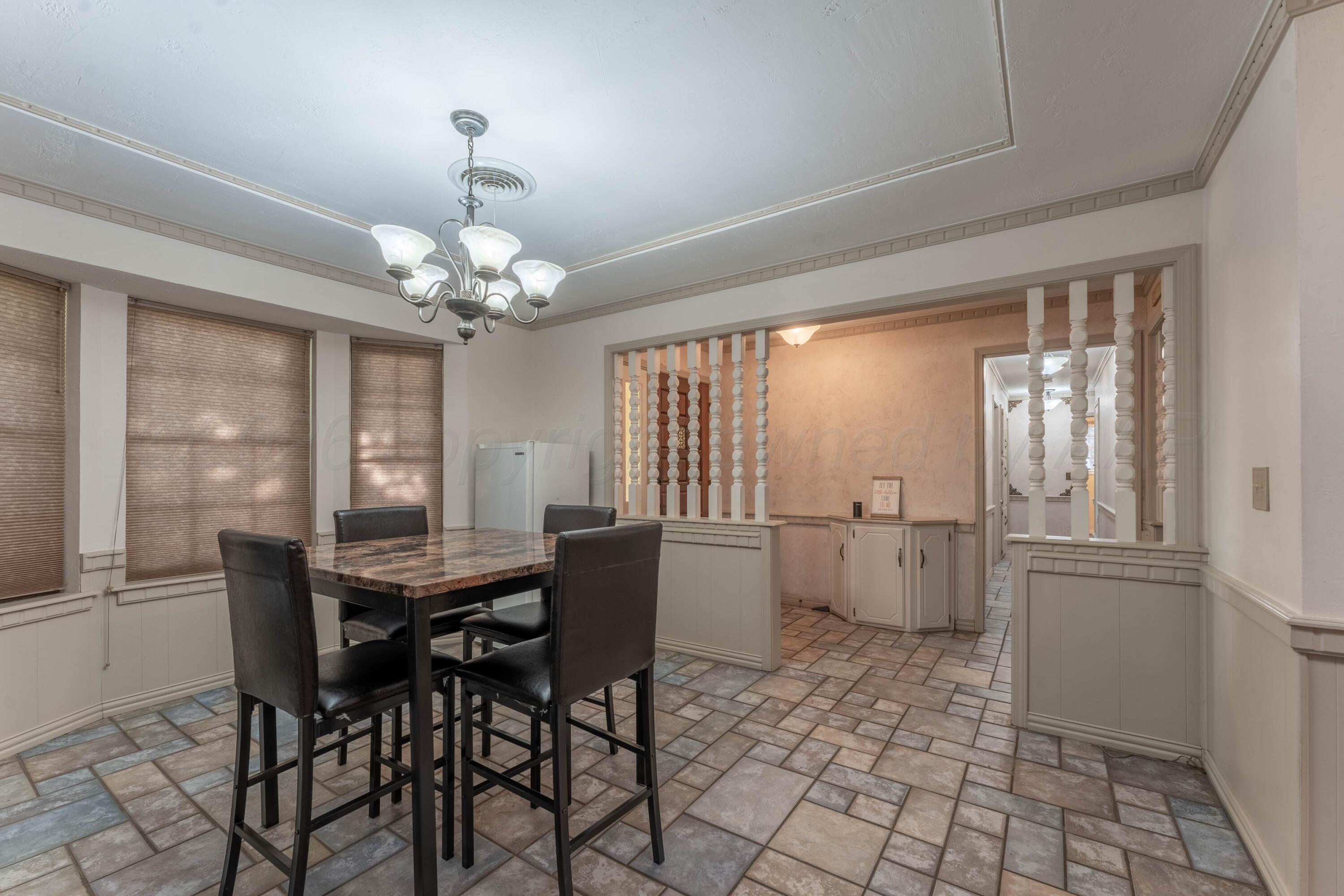 6606 Drexel Road Amarillo, TX 79109 - Photo 21 of 44 a dining room with furniture and window