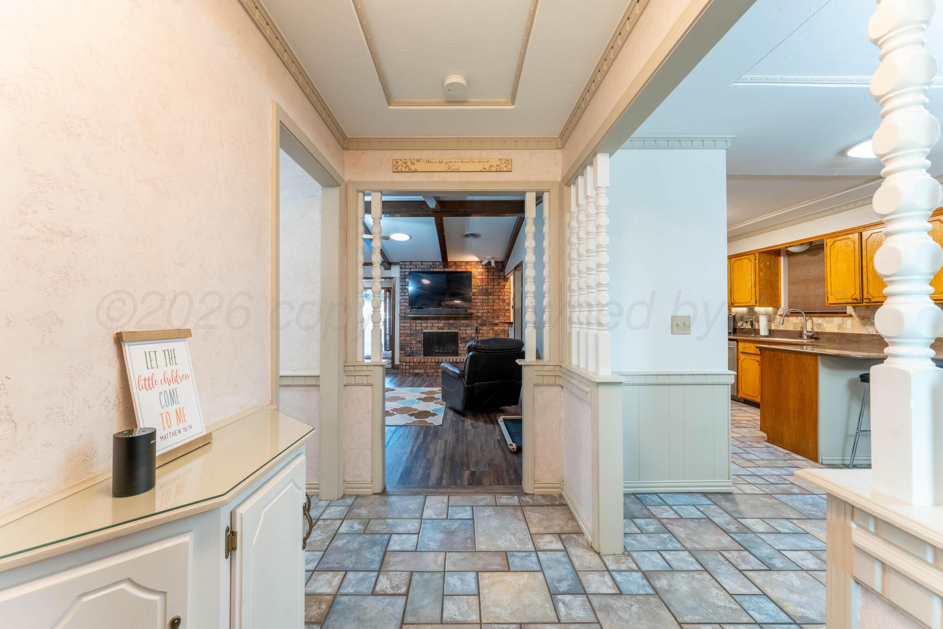 6606 Drexel Road Amarillo, TX 79109 - Photo 4 of 44 a kitchen with a refrigerator and a stove