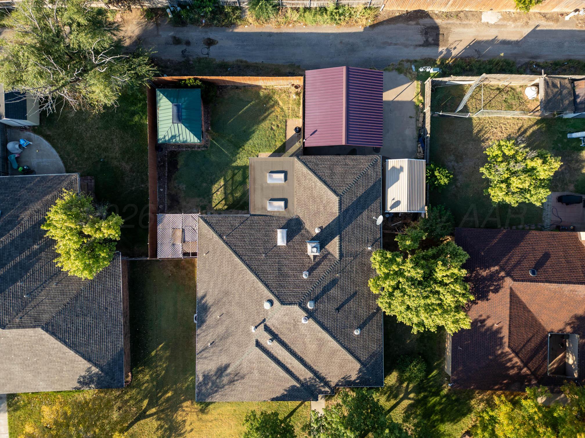 6606 Drexel Road Amarillo, TX 79109 - Photo 42 of 44 an aerial view of a house with a yard and garden