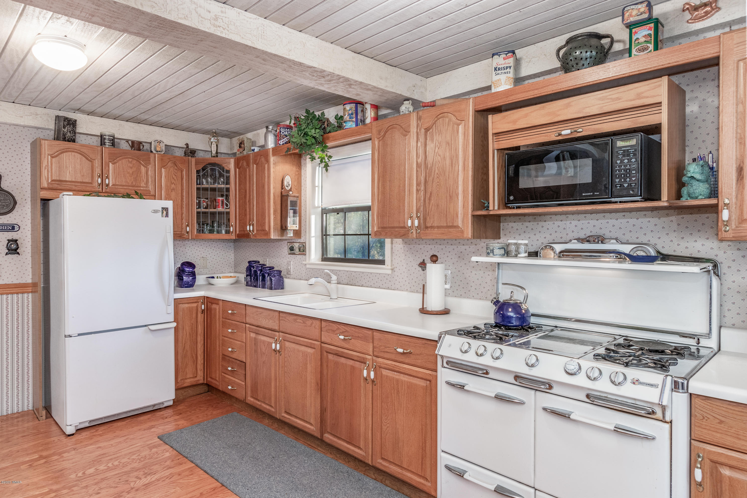 1939 Artist Draw Road Heber, AZ 85928 - Photo 11 of 40 a kitchen with stainless steel appliances granite countertop a refrigerator a stove a sink and a microwave
