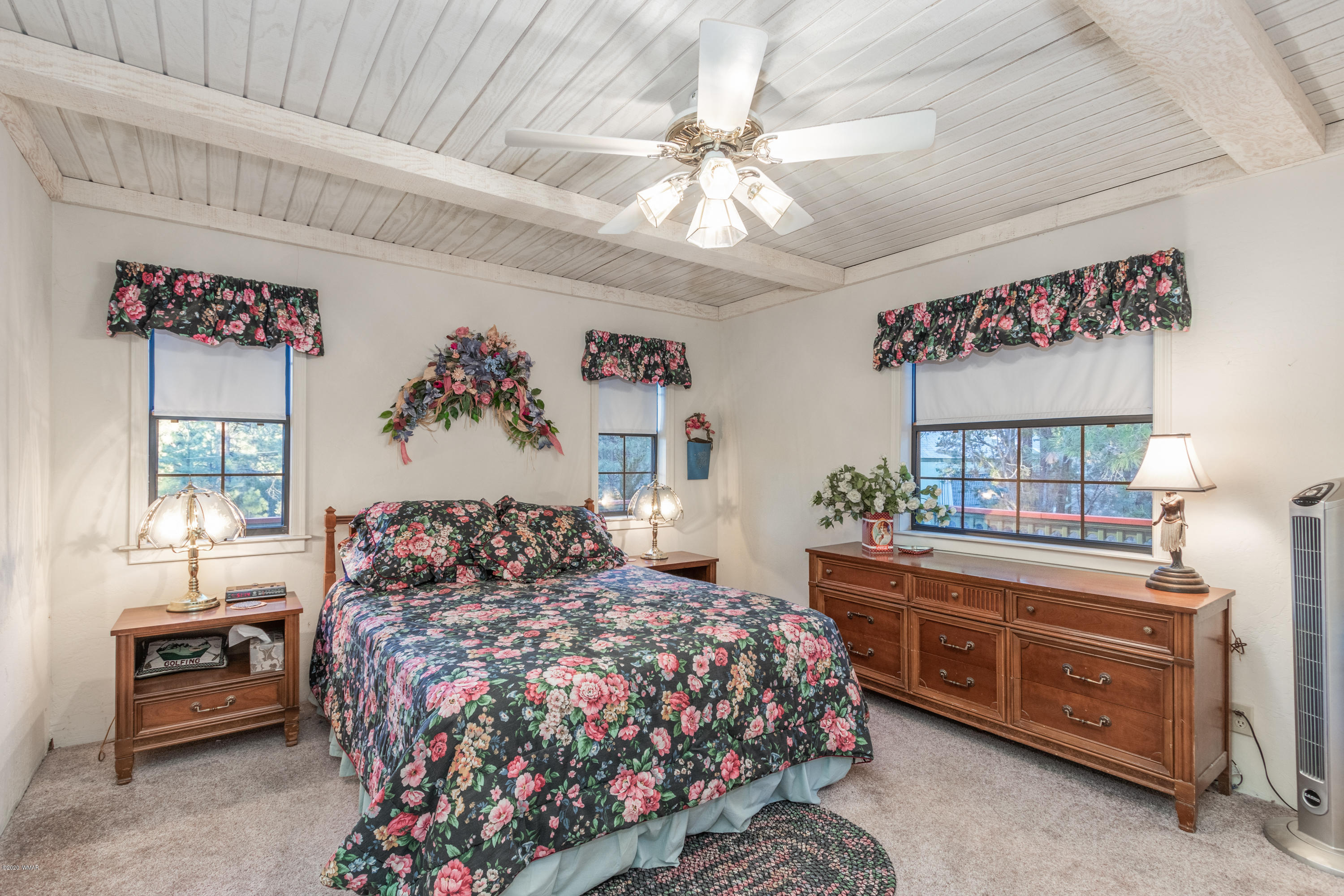 1939 Artist Draw Road Heber, AZ 85928 - Photo 19 of 40 a bedroom with a large bed and a chandelier