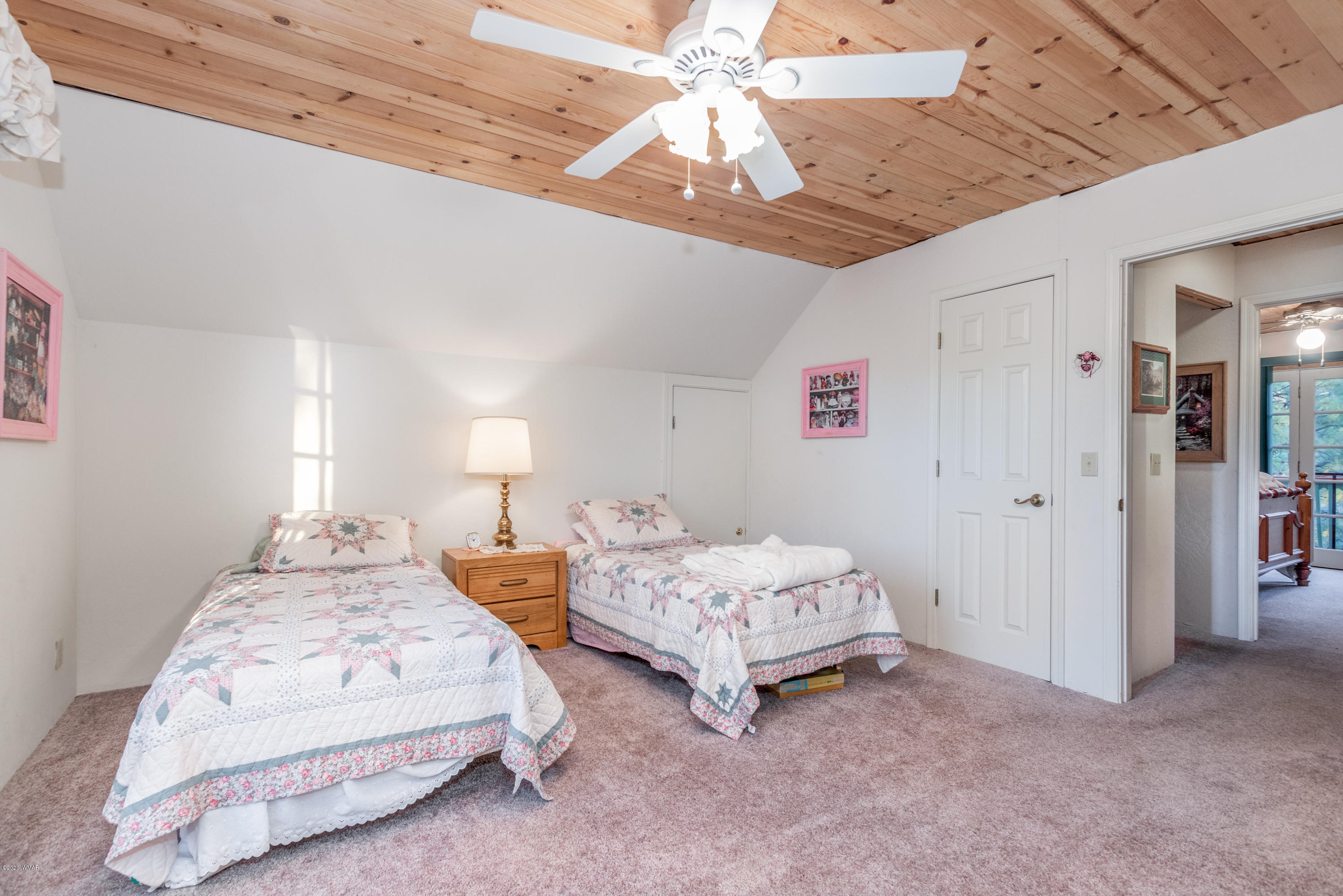 1939 Artist Draw Road Heber, AZ 85928 - Photo 21 of 40 a spacious bedroom with a bed and a chandelier