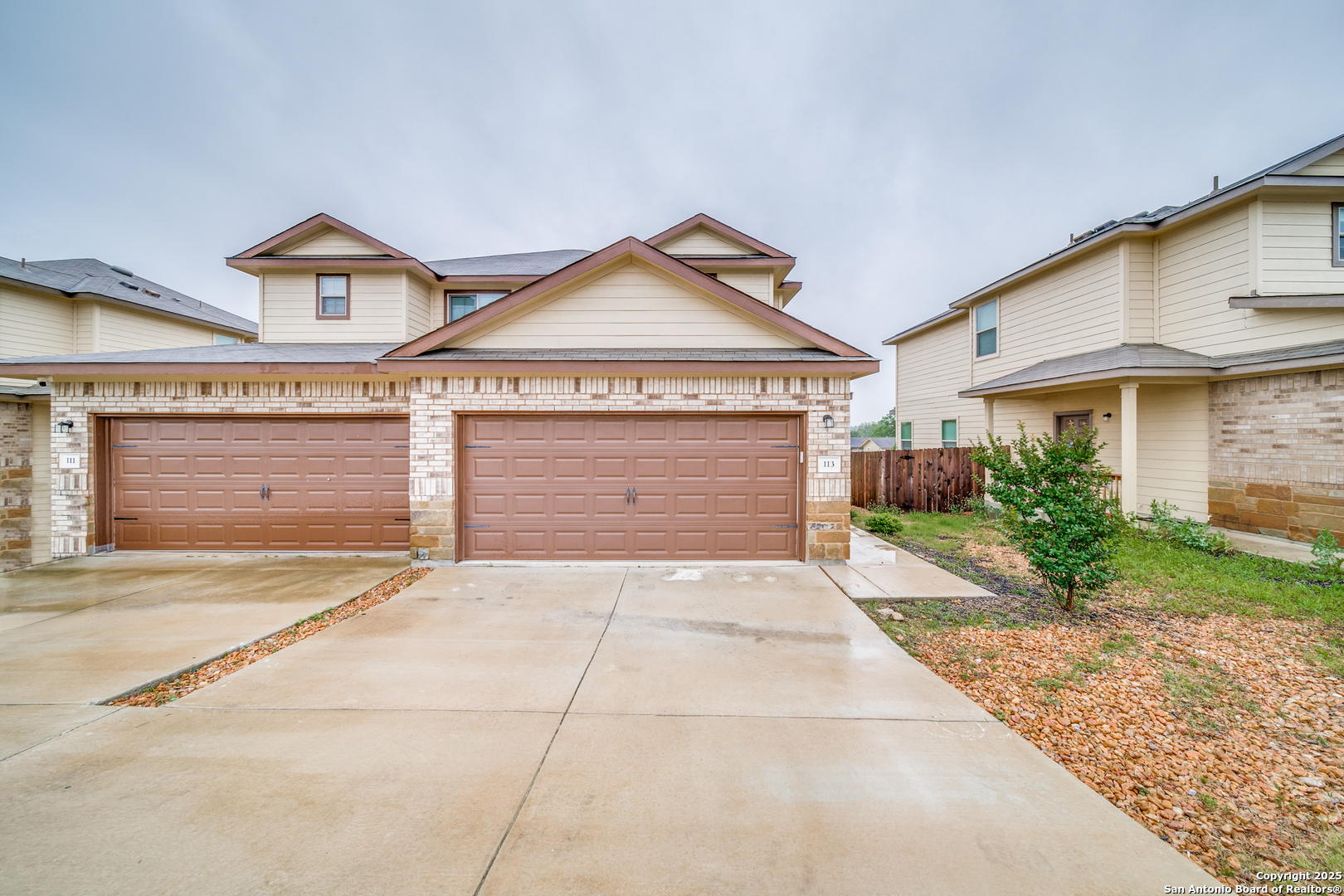 113 Highland View New Braunfels, TX 78130 - Photo 1 of 1 a front view of a house with a yard and garage