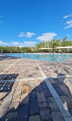 a view of a street with a building in the background
