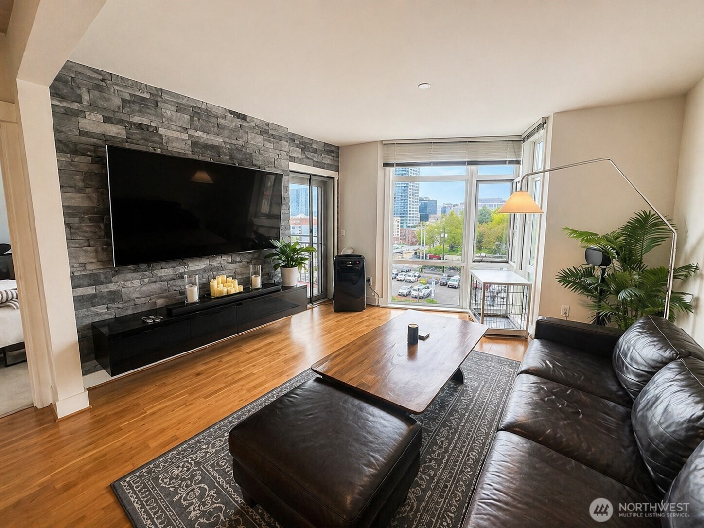 699 John Street, Unit 515 Seattle, WA 98109 - Photo 11 of 26 a living room with furniture and a flat screen tv