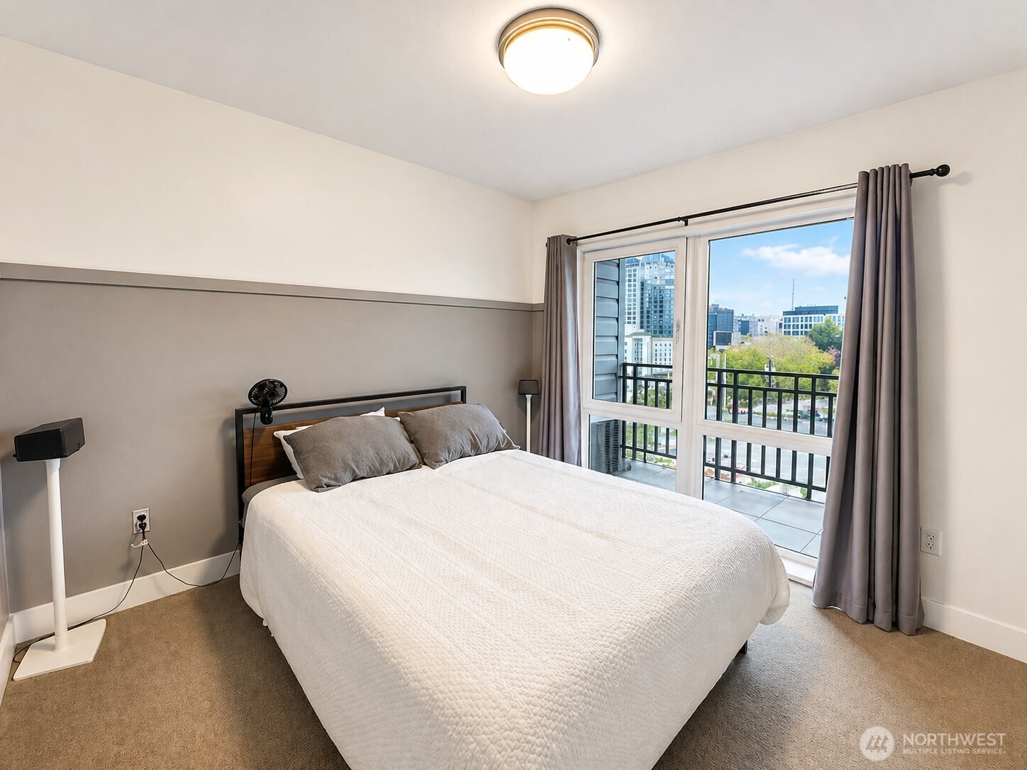 699 John Street, Unit 515 Seattle, WA 98109 - Photo 13 of 26 a bedroom with a large bed and a large window